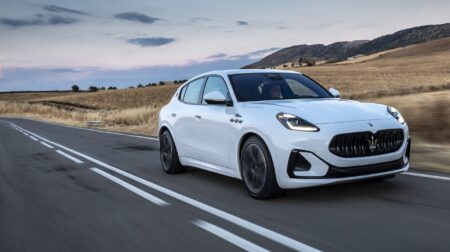 Maserati Grecale Folgore driving down a country road.