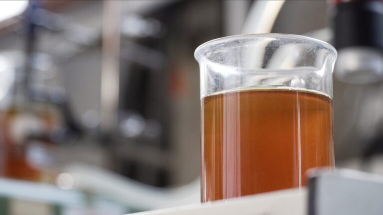 Opinion: How Michelin’s ResiCare helped make 100 million tires A glass beaker in a chemical laboratory, three-quarters full with a brown liquid.