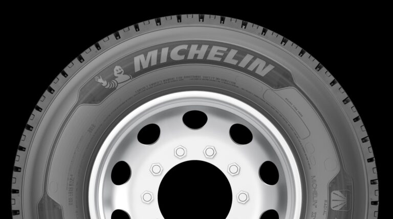 Michelin X Line Grip D tire shown in profile against a black background.