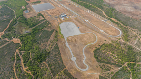 Smithers Earns ISO 17025 Accreditation at Proving Grounds in Pearsall, Texas, shown here in an aerial show, with winding test traks surrounded by brown and green land.