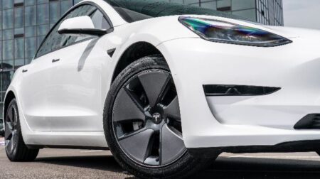A white Tesla EV with Enso tires