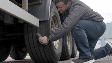 Transense unveils lower-cost TLGX3 and TLGX4 tire inspection tools Transense Technologies managing director Ryan Maughan inspects a truck trailer tire with TLGX4.