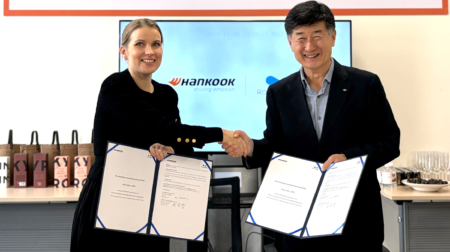Hyuncheol Kim, COO of Hankook Tire China, and Rotoboost CEO Kaisa Nikulainen shake hands at the signing ceremony for a new MOU
