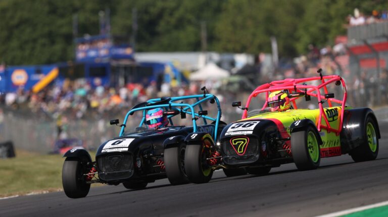 Two Caterhams on a racetrack with Nova tire fittings.