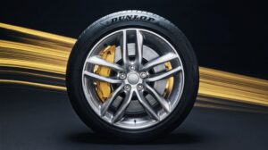 The new Dunlop Blue Response TG summer tire on a black background with a yellow ribbon running horizontally.