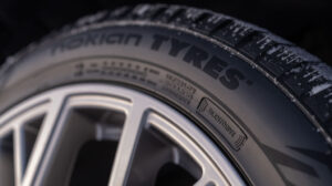 Close up of a Nokian Tyres tire with company branding on the sidewall