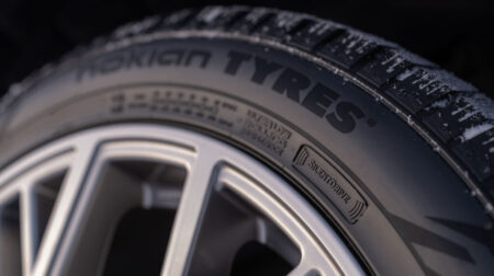 Close up of a Nokian Tyres tire with company branding on the sidewall