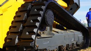 Close up of the rubber tracks in a close up of a piece of agriculture/construction equipment.