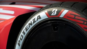 The Bridgestone Potenza Gen4 tire on a racing car.